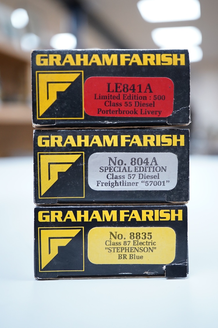 Three boxed Graham Farish N gauge railway electric and diesel locomotives; a Porterbrook class 55, Gordon Highlander (LE841A), a Freightliner class 57, Freightliner Pioneer 57001 (804A), and a BR class 87, Stephenson 871